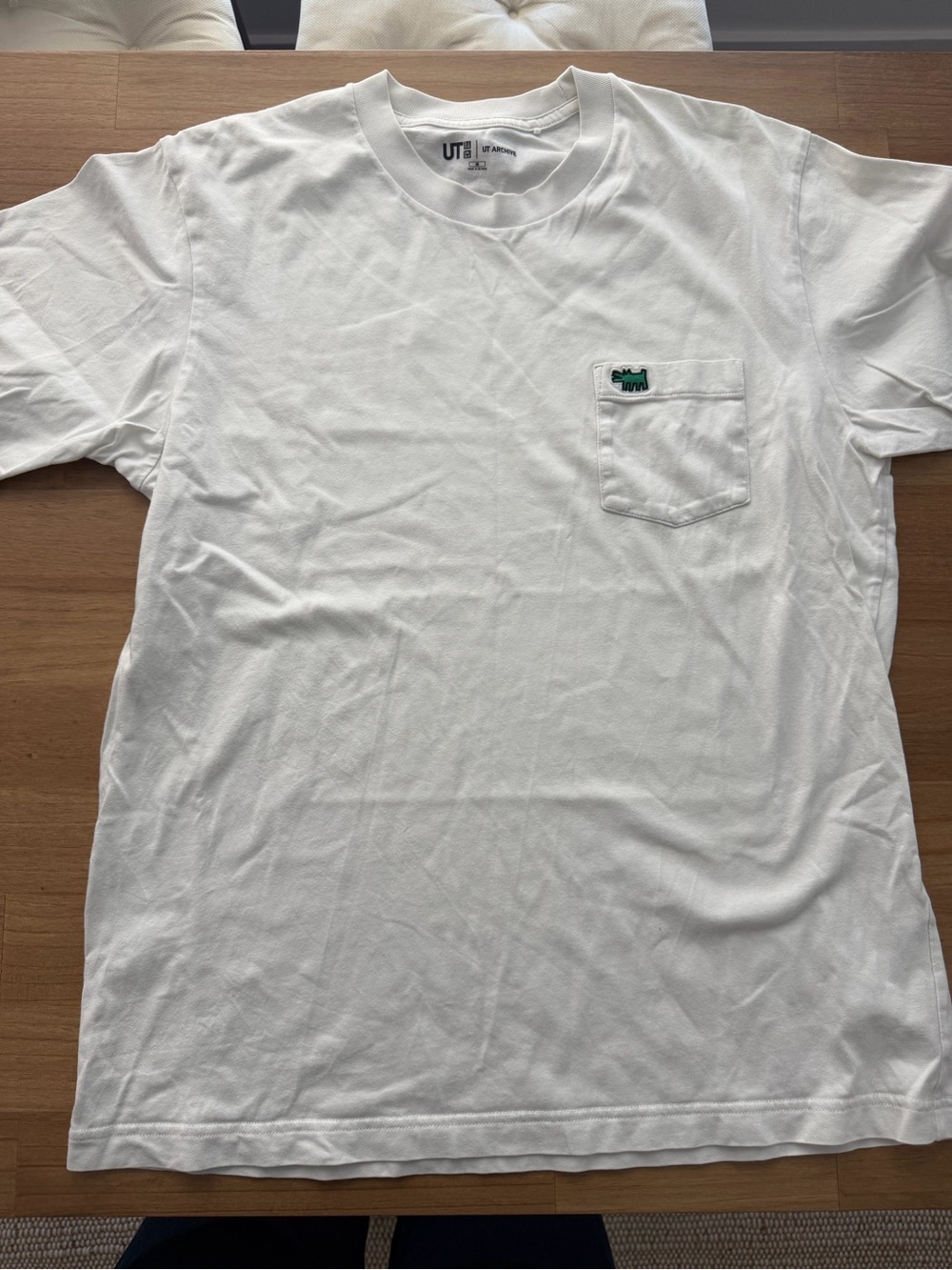 Uniqlo White Pocket Tee with Small Green Patch